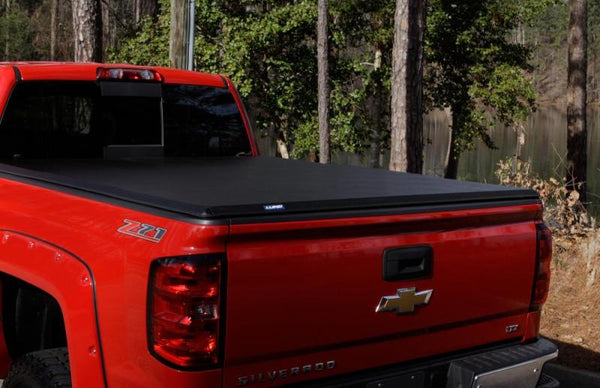 Lund 05-17 fits Nissan Frontier Styleside (5ft. Bed) Hard Fold Tonneau Cover - Black